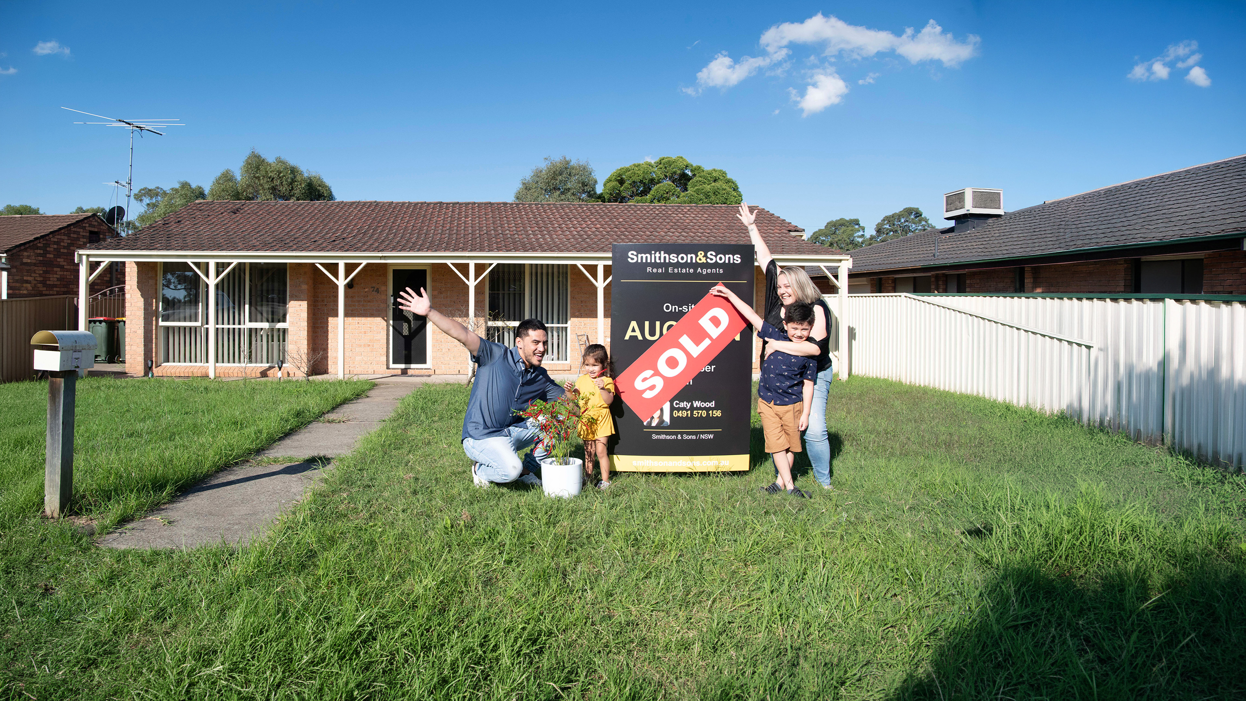 Family celebrating a sold home